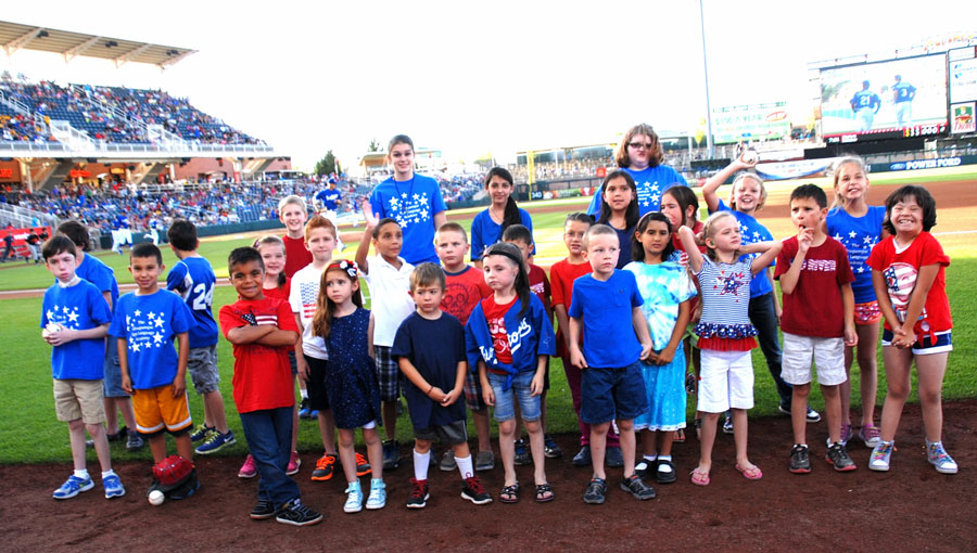 Students from the ASL Academy on the field at the Isotopes.